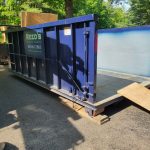 Empty rental dumpster from Reeds Dumpsters and Demolition LLC