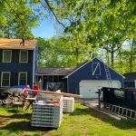 Rental dumpster from Reeds Dumpsters and Demolition LLC in use during roofing project